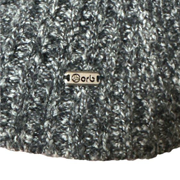 Orb knit sleeveless sweater vest with waist and neck closure cable knit sections - Picture 6 of 7